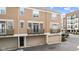 Two-story condo featuring private garage, balcony, and neutral-toned exterior at 907 Junction Pl # 41907, Indianapolis, IN 46220