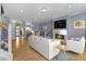 Bright living room with hardwood floors, modern fireplace, and an open floor plan at 907 Junction Pl # 41907, Indianapolis, IN 46220