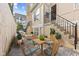 Cozy patio with outdoor seating, table, and direct access to the building entrance at 907 Junction Pl # 41907, Indianapolis, IN 46220