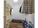 Spacious walk-in closet with shelving, hanging rods, wood floors, and bench at 907 Junction Pl # 41907, Indianapolis, IN 46220