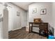 Hallway with light-gray walls, wooden floors and classic decor at 9449 Maple Way, Indianapolis, IN 46268