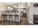 View of the kitchen from the bar area, featuring stainless steel appliances and light-gray cabinets at 9449 Maple Way, Indianapolis, IN 46268