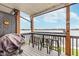 Inviting balcony area featuring a grill, bar-style seating, and stunning lake views for delightful outdoor gatherings at 102 Clarendon Dr # 514, Noblesville, IN 46062