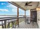 Relaxing balcony with ceiling fan, bar seating, and lake views; perfect for entertaining and enjoying the scenery at 102 Clarendon Dr # 514, Noblesville, IN 46062