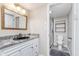 Bathroom with granite vanity, shower and decorative mirror at 102 Clarendon Dr # 514, Noblesville, IN 46062