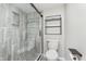 Modern bathroom with stone shower, glass door and wood style floors at 102 Clarendon Dr # 514, Noblesville, IN 46062