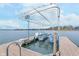 Modern boat lift on a peaceful lake, offering convenient storage and protection for your watercraft with picturesque backdrop at 102 Clarendon Dr # 514, Noblesville, IN 46062