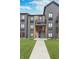 Apartment building exterior shows stone facade, stairways and a walkway surrounded by green grass at 102 Clarendon Dr # 514, Noblesville, IN 46062