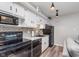 Cozy kitchen with black appliances, sleek countertops, and eye-catching tile backsplash at 102 Clarendon Dr # 514, Noblesville, IN 46062