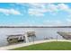 Scenic lake view featuring boat docks and lifts, offering a picturesque waterfront panorama and inviting atmosphere at 102 Clarendon Dr # 514, Noblesville, IN 46062