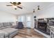 Cozy living room featuring a stone fireplace, wood flooring and walk out balcony at 102 Clarendon Dr # 514, Noblesville, IN 46062
