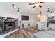 Comfortable living room with a stone fireplace, modern TV, and open kitchen area at 102 Clarendon Dr # 514, Noblesville, IN 46062