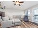 Comfortable living room with wood flooring, neutral tones, and access to balcony at 102 Clarendon Dr # 514, Noblesville, IN 46062