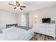 Bright and airy bedroom with wood flooring, ceiling fan and dresser at 102 Clarendon Dr # 514, Noblesville, IN 46062