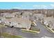 An aerial view showcases the townhouse community with manicured lawns and paved driveways at 1160 Falcon Rdg, Carmel, IN 46280
