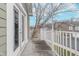 A cozy outdoor balcony with white railings and double doors offering a tranquil neighborhood view at 1160 Falcon Rdg, Carmel, IN 46280