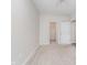 A bright, empty bedroom with neutral carpet, a ceiling fan and an adjoining closet area at 1160 Falcon Rdg, Carmel, IN 46280