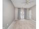 Bright bedroom with neutral carpeting and a door to a private balcony at 1160 Falcon Rdg, Carmel, IN 46280