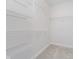 A spacious, walk-in closet with metal shelving, providing ample storage at 1160 Falcon Rdg, Carmel, IN 46280