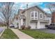 Charming townhouse featuring a two-car garage, neutral siding, and well-maintained landscaping at 1160 Falcon Rdg, Carmel, IN 46280
