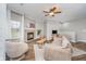 Cozy living area featuring a fireplace, wood-look floors, and comfortable seating at 1160 Falcon Rdg, Carmel, IN 46280