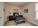 Well-decorated bedroom with a bed, black nightstands, and colorful artwork at 13395 Vickery Ridge Dr, Fishers, IN 46037