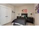 A stylish bedroom with a black bed frame, fun wall art and unique night stands at 13395 Vickery Ridge Dr, Fishers, IN 46037