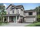 Charming two-story home with a covered porch, modern architectural design and manicured front yard at 13395 Vickery Ridge Dr, Fishers, IN 46037