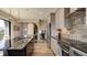 Stylish kitchen featuring stainless steel appliances, sleek cabinetry, and a center island with bar seating at 13395 Vickery Ridge Dr, Fishers, IN 46037