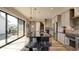 Bright kitchen featuring a large island with seating and plenty of natural light from a large sliding glass door at 13395 Vickery Ridge Dr, Fishers, IN 46037