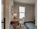 A cozy home office with a wooden desk, comfortable chair, and natural lighting at 13395 Vickery Ridge Dr, Fishers, IN 46037