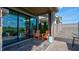 Relax on the patio featuring a sliding door to the interior and comfortable orange rocking chairs with blue pillows at 13395 Vickery Ridge Dr, Fishers, IN 46037