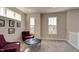 Bright sitting area with large windows, comfortable seating, and modern decor at 13395 Vickery Ridge Dr, Fishers, IN 46037
