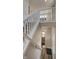 An open staircase featuring white railings and carpeted steps at 13395 Vickery Ridge Dr, Fishers, IN 46037
