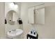 Bright bathroom with a pedestal sink, medicine cabinet, and modern fixtures at 1347 Shaw Ln, Shelbyville, IN 46176