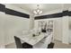 Stylish dining room features modern decor, a marble table, and open shelving at 1347 Shaw Ln, Shelbyville, IN 46176