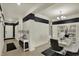 Elegant dining room with marble table, stylish chairs, and decorative shelving at 1347 Shaw Ln, Shelbyville, IN 46176