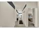 Modern hallway features stylish decor leading to a bedroom with a comfortable bed at 1347 Shaw Ln, Shelbyville, IN 46176