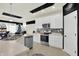 Bright kitchen with stainless appliances, stone counters, and white cabinets at 1347 Shaw Ln, Shelbyville, IN 46176