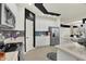 Well-equipped kitchen with stainless appliances, stone counters, and white cabinets at 1347 Shaw Ln, Shelbyville, IN 46176