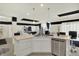 Modern kitchen featuring stainless steel appliances, a kitchen island with bar seating, and white cabinets at 1347 Shaw Ln, Shelbyville, IN 46176