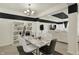 Open concept living space showcases dining area and plush white living room set at 1347 Shaw Ln, Shelbyville, IN 46176