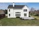 Expansive backyard with a well-maintained lawn, a charming deck, and a two-story white home at 1351 Sullivans Rdg, Zionsville, IN 46077