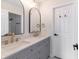 Modern bathroom featuring double vanity, quartz countertop, and bronze fixtures at 1351 Sullivans Rdg, Zionsville, IN 46077