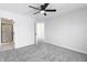 Bright bedroom with ceiling fan and ensuite featuring a walk-in shower; perfect for relaxation at 1351 Sullivans Rdg, Zionsville, IN 46077