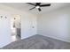 Bedroom with new carpet, ceiling fan, en-suite bathroom at 1351 Sullivans Rdg, Zionsville, IN 46077