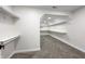 Spacious walk-in closet with built-in shelving and carpet at 1351 Sullivans Rdg, Zionsville, IN 46077