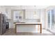 Beautiful kitchen featuring white cabinets, a center island, stainless steel appliances, and stylish pendant lighting at 1351 Sullivans Rdg, Zionsville, IN 46077