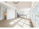 Bright, open-concept living space with views to kitchen, hardwood floors, and high ceilings at 1351 Sullivans Rdg, Zionsville, IN 46077