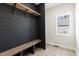 Mudroom with bench, hooks, shelves and natural light at 1351 Sullivans Rdg, Zionsville, IN 46077